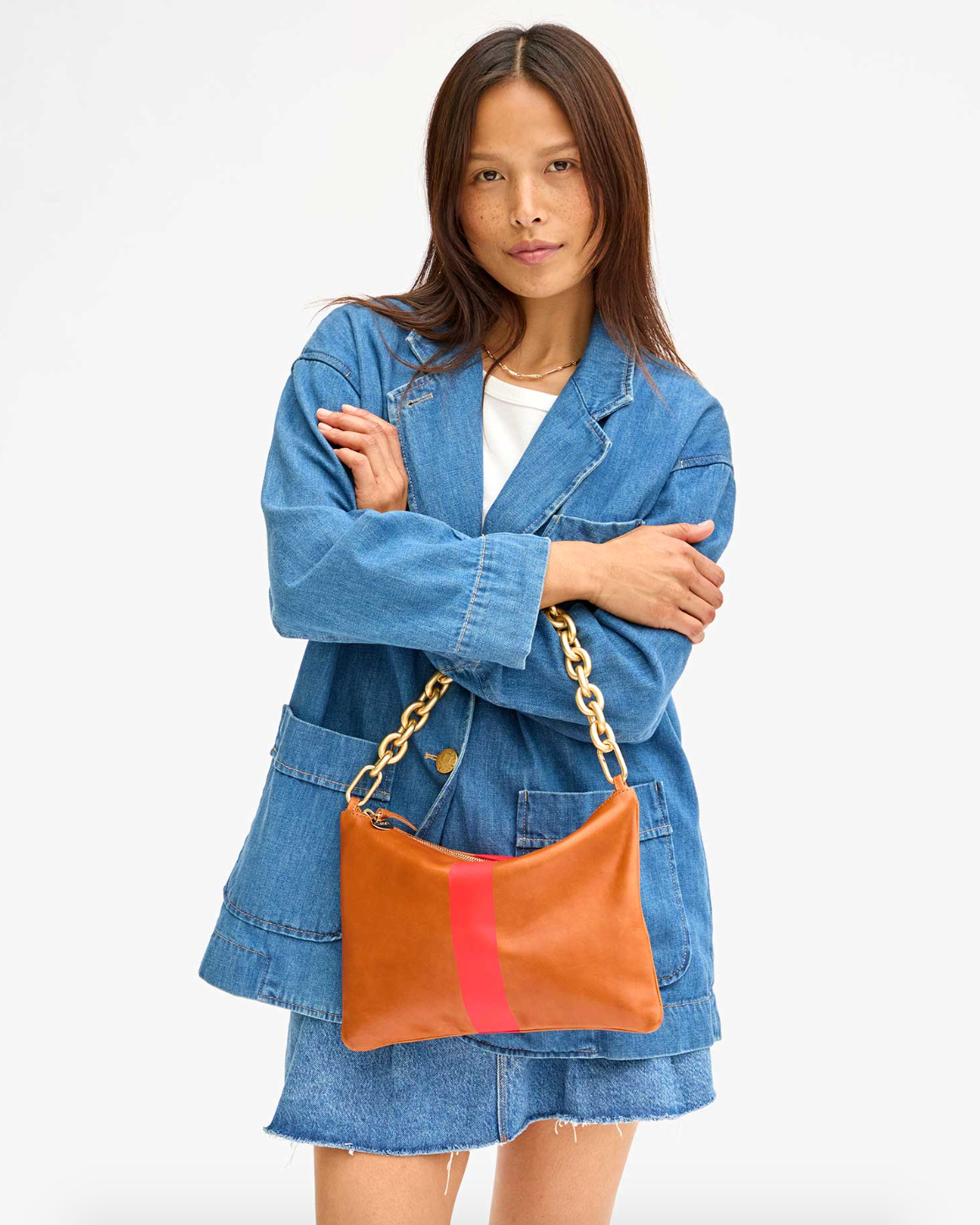 Person wearing bag with Clare V Convertible Shortie Bag Strap in Gold