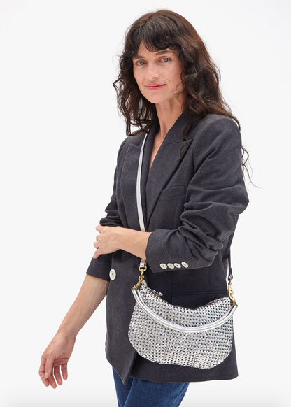 Person wearing Clare V Petit Moyen Messenger Handbag in Silver Leather Woven Etoile
