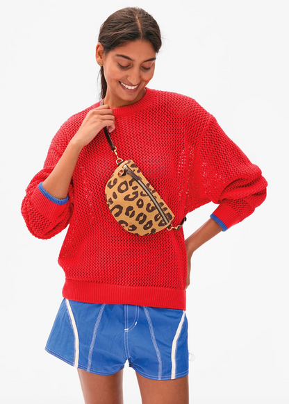 person wearing Clare V Petite Fanny in lark pablo cat suede crossbody bag