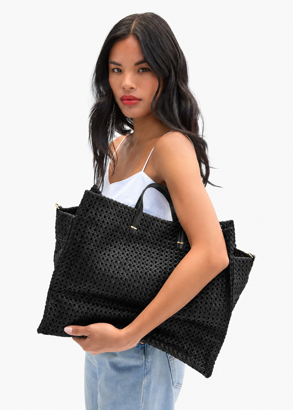 person carrying Clare V Simple Tote in Black Rattan Leather