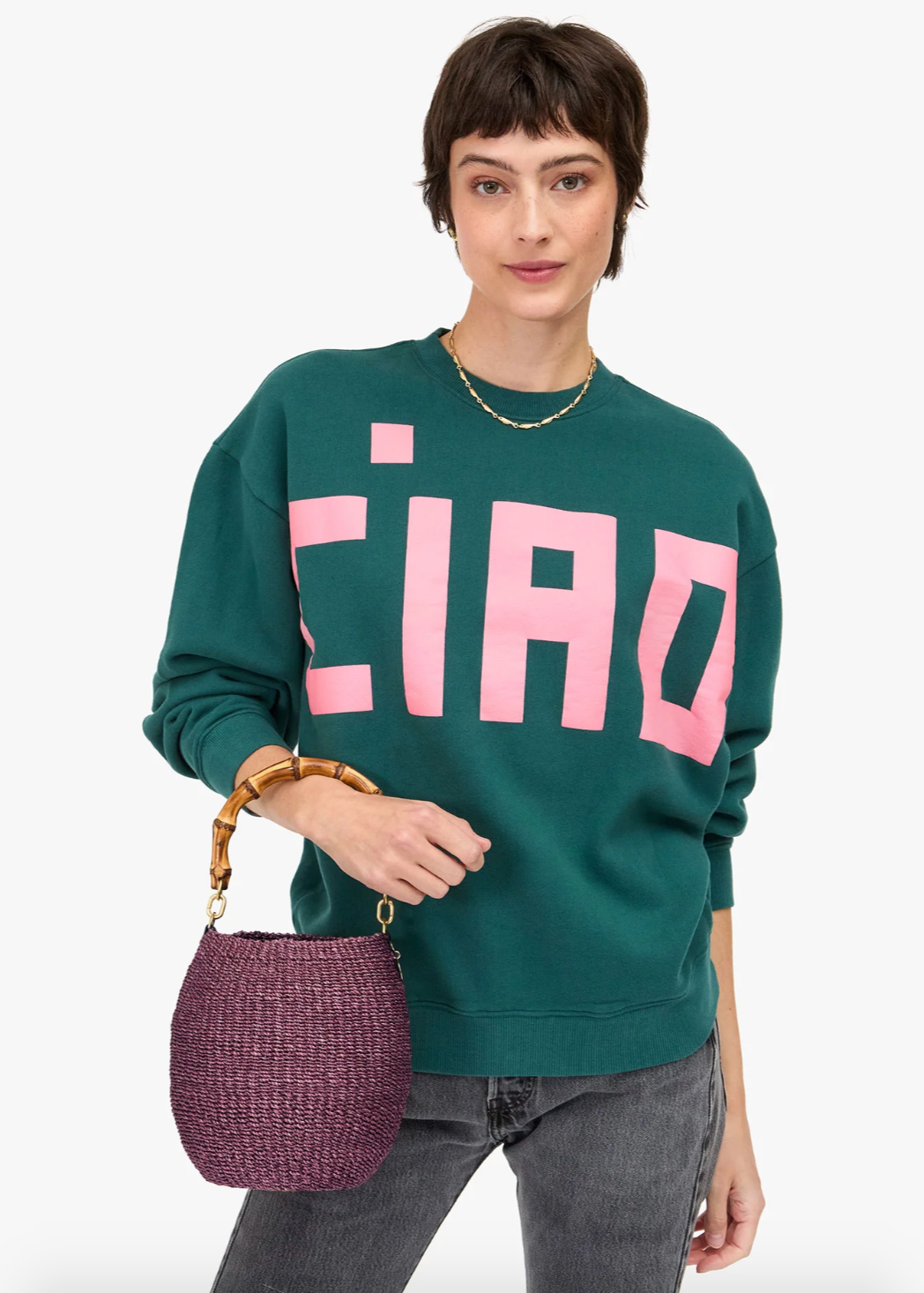 Person wearing Clare V Straw Pot De Miel Bag in Black with Bamboo Handle