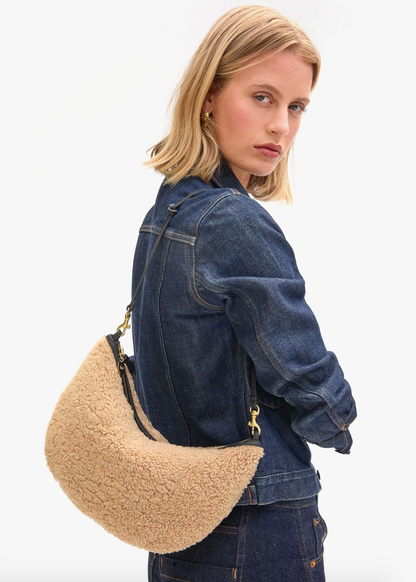 Person wearing Clare V womens Lune Bag in Shearling Leather