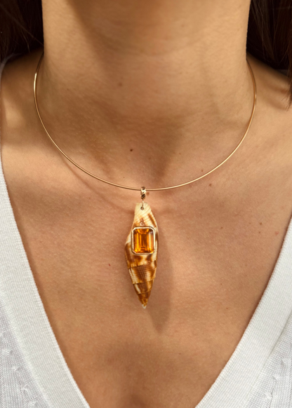 person wearing Dezso fine jewelry 18k rose gold Large Natural Seashell with Emerald Cut Citrine