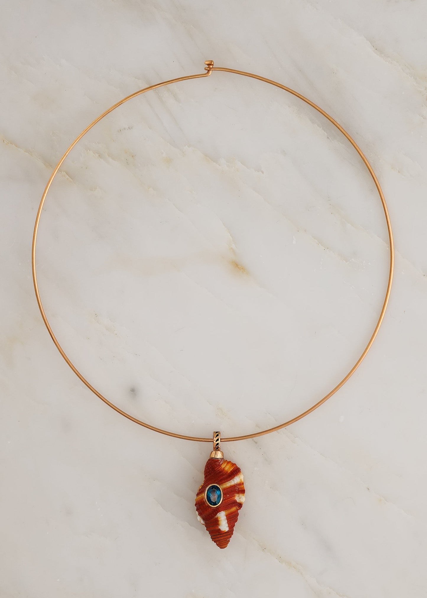 Dezso fine jewelry 18k rose gold Natural Triton Shell with Blue Zircon