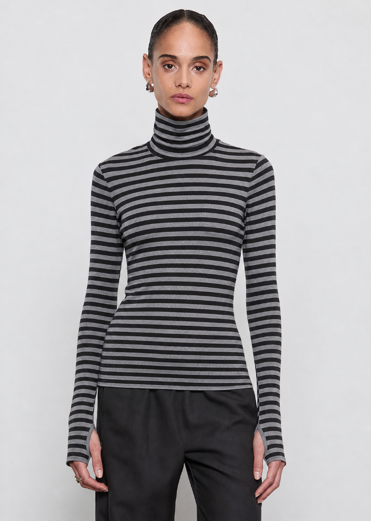person wearing ENZA COSTA womens Cashmere New Classic Mini Stripe Turtleneck in Smoke & Black