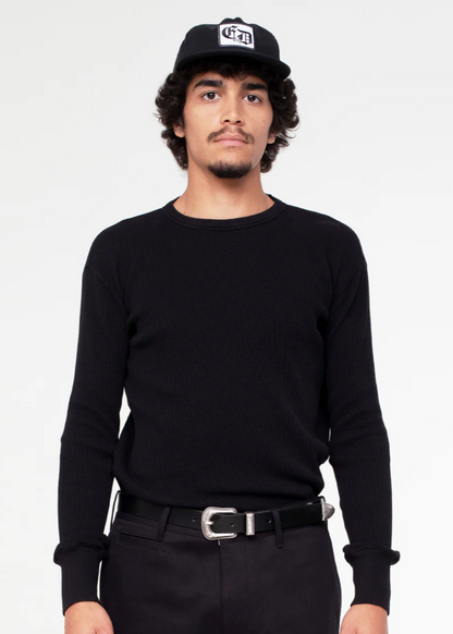 Person wearing Eat Dust Mens Waffle Jersey Long Sleeve Tee Black