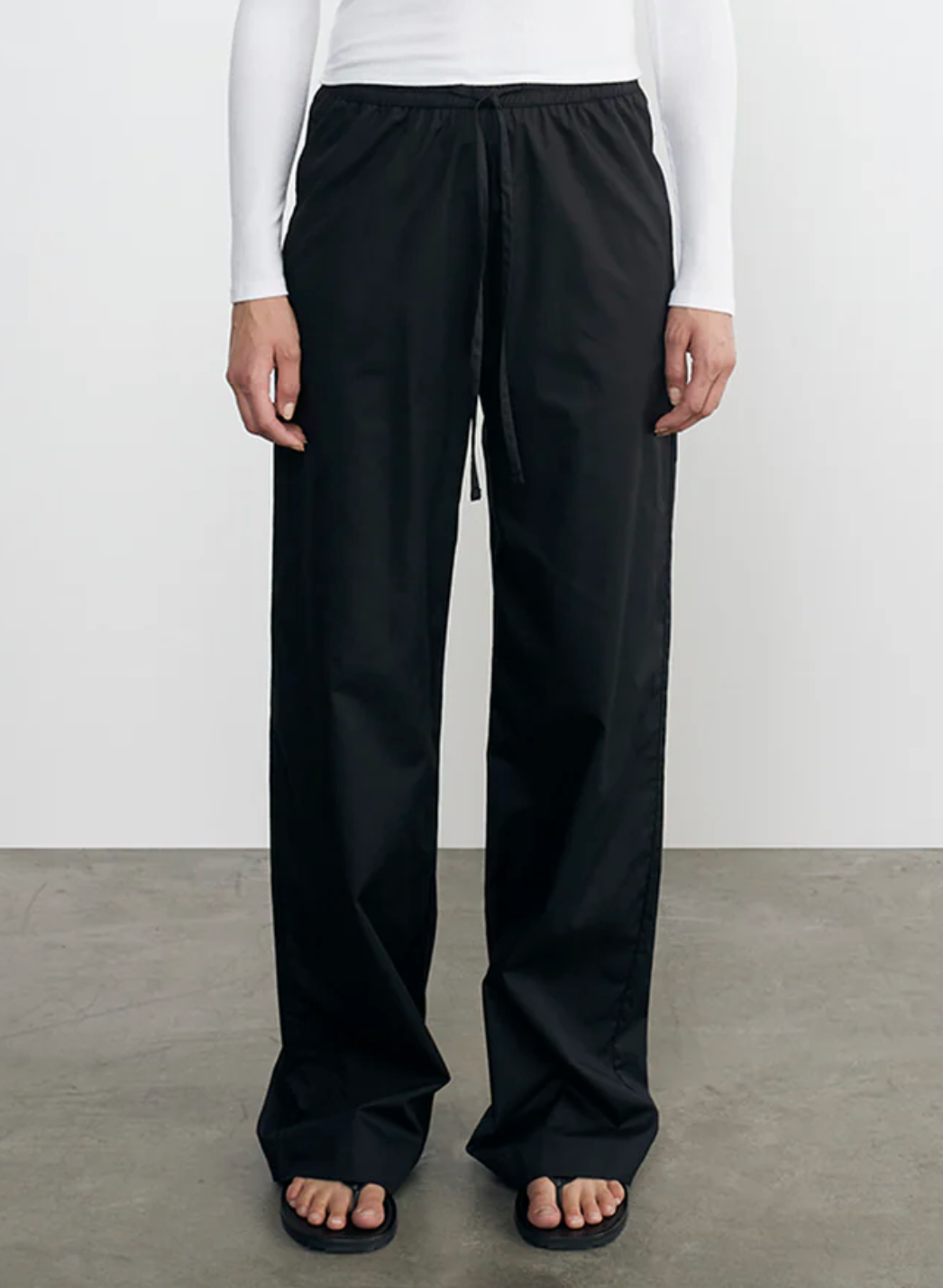 Person wearing Enza Costa Cotton Resort Pant in Black