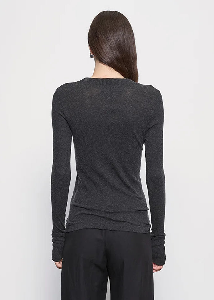 person wearing Enza Costa womens Cashmere Easy Cuffed Crew in Charcoal gray