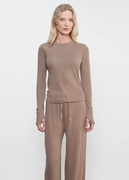  Person wearing Enza Costa womens Cashmere Easy Cuffed Crew in Walnut