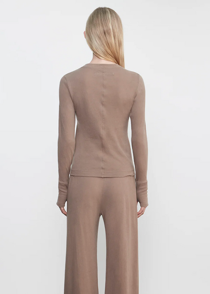 Person wearing Enza Costa womens Cashmere Easy Cuffed Crew in Walnut