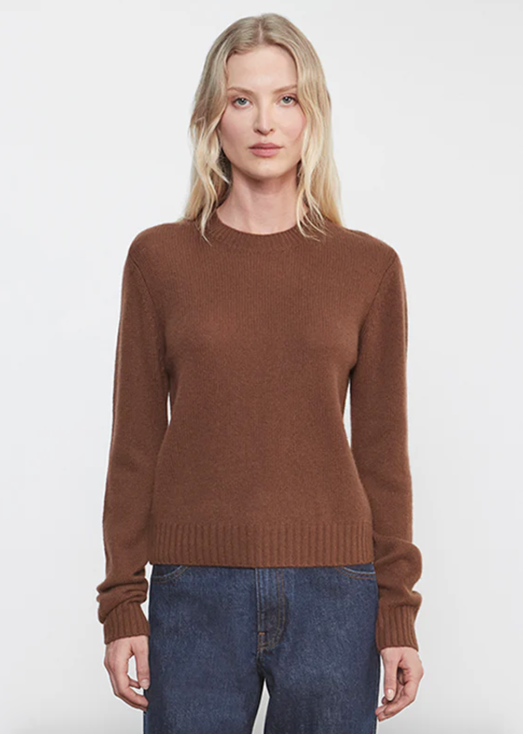 Person wearing Enza Costa womens Cashmere Easy Long Sleeve Crew in Nutmeg