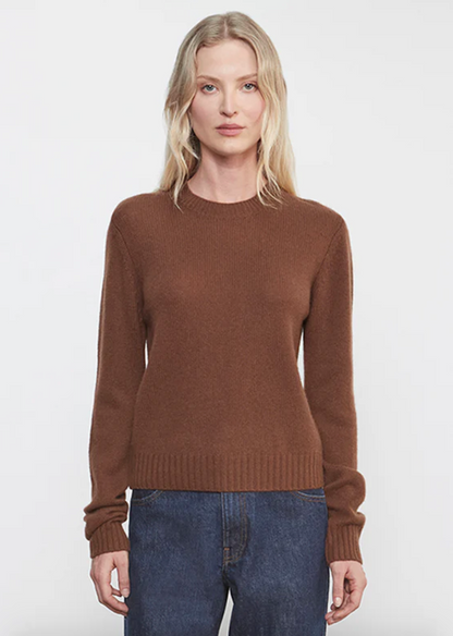 Person wearing Enza Costa womens Cashmere Easy Long Sleeve Crew in Nutmeg