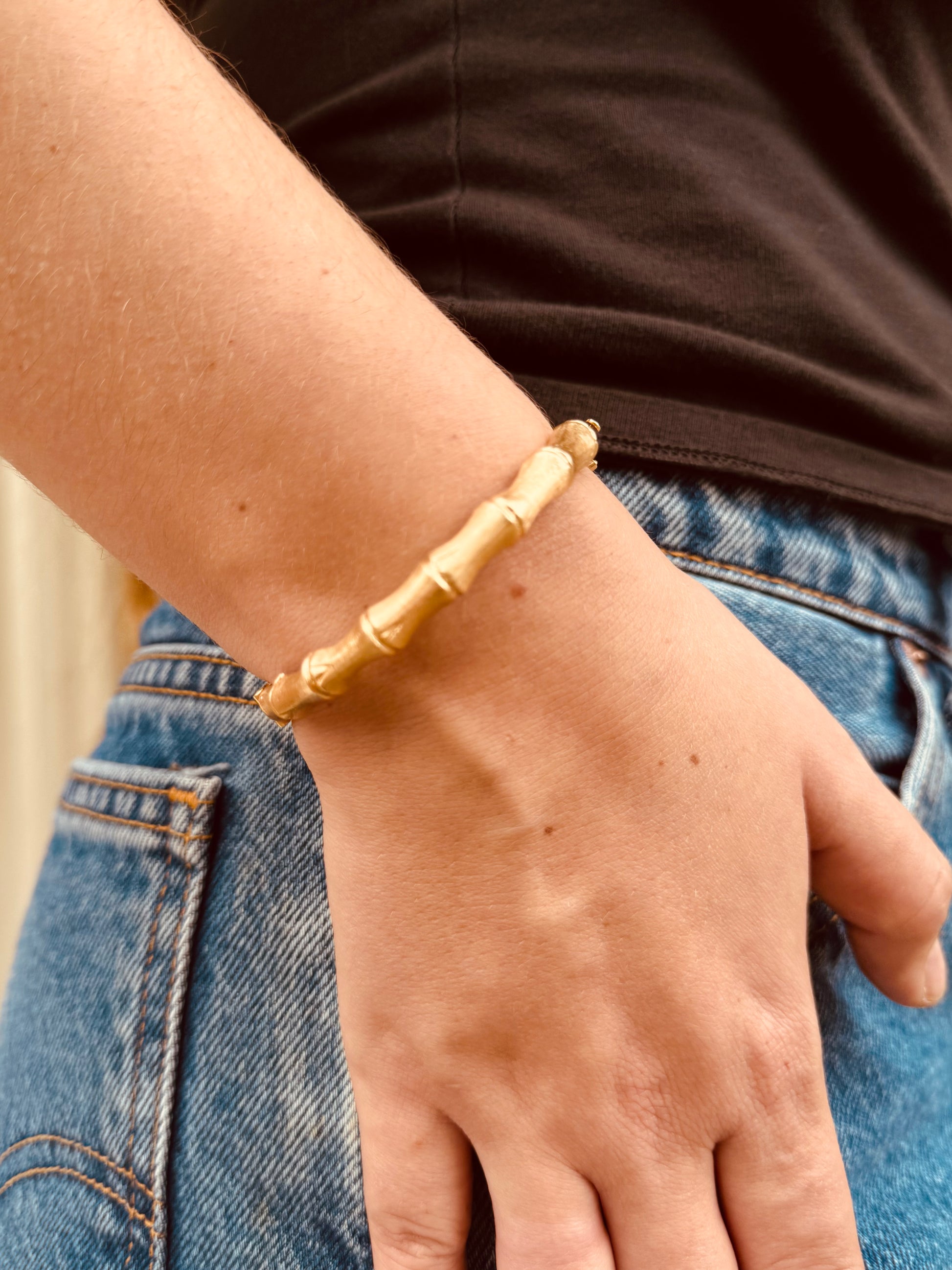 Person wearing Fine jewelry 14k yellow Vintage Gold Bamboo Bangle