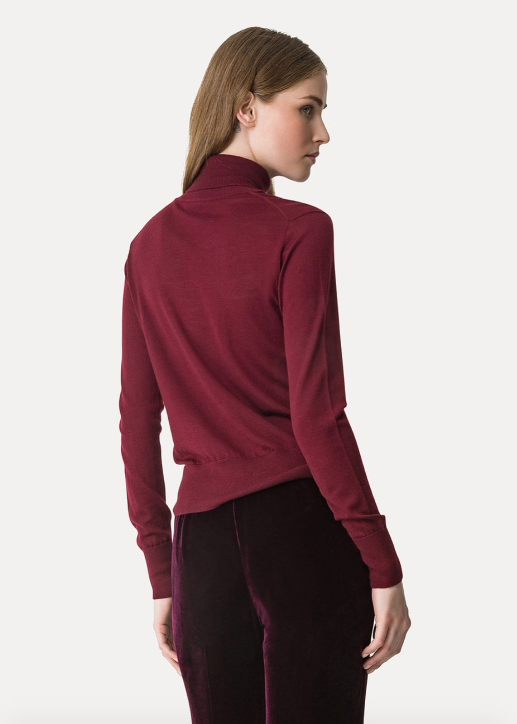 Person wearing Forte Forte High–Neck Sweater in Superfine Merino Wool Bordeaux