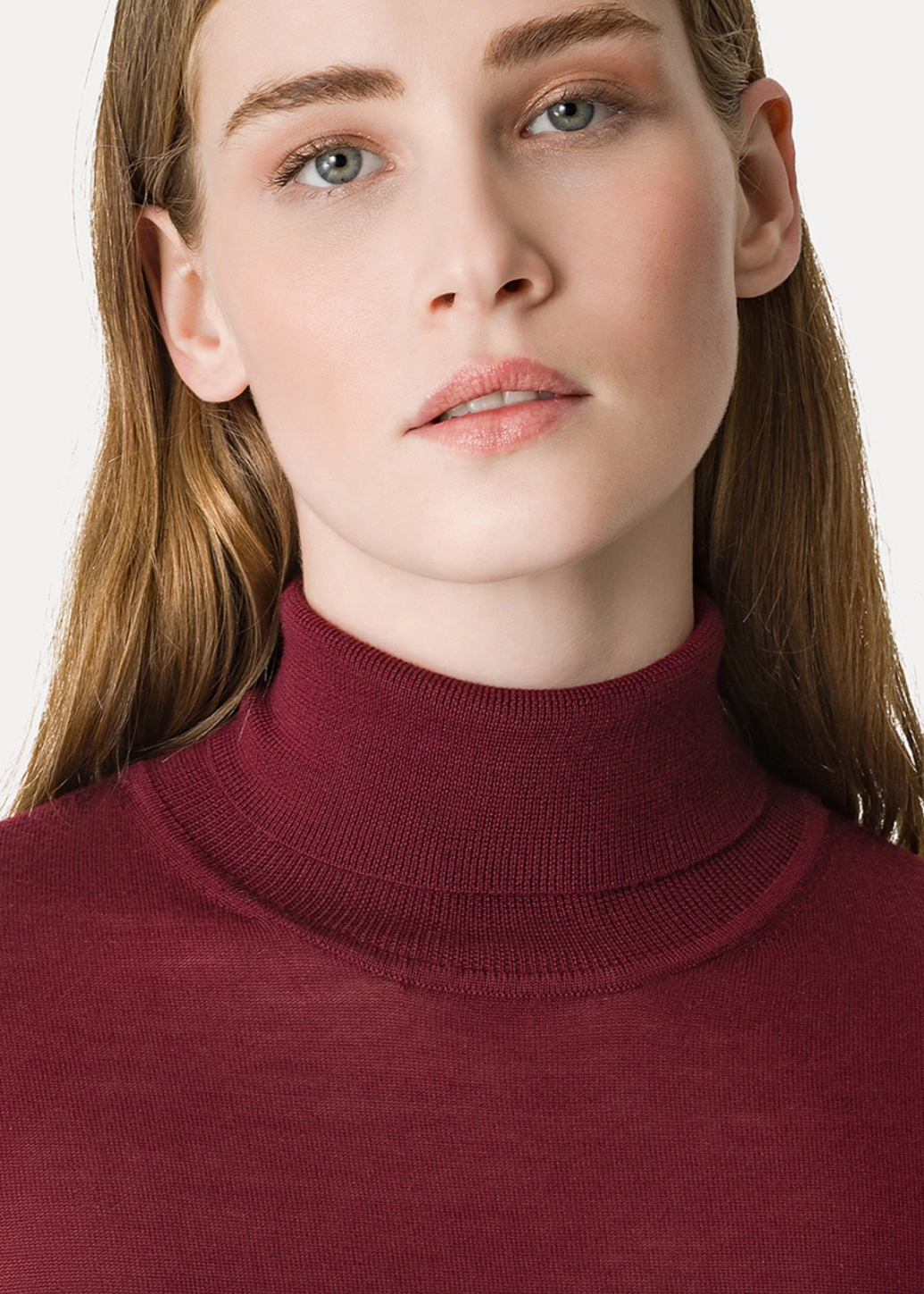 Person wearing Forte Forte High–Neck Sweater in Superfine Merino Wool Bordeaux