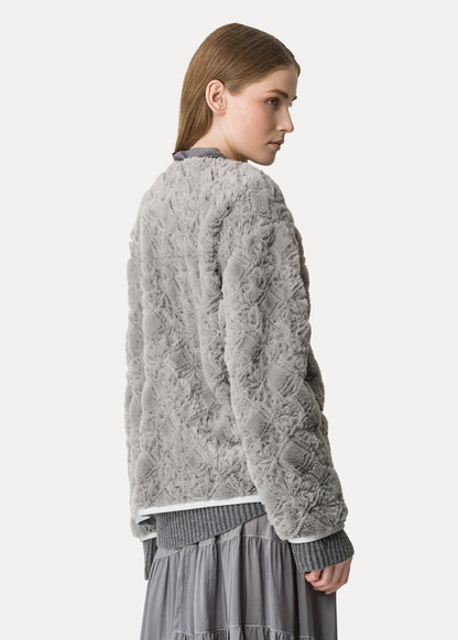 Person wearing Forte forte Embroidered Faux Fur Jacket pearl grey