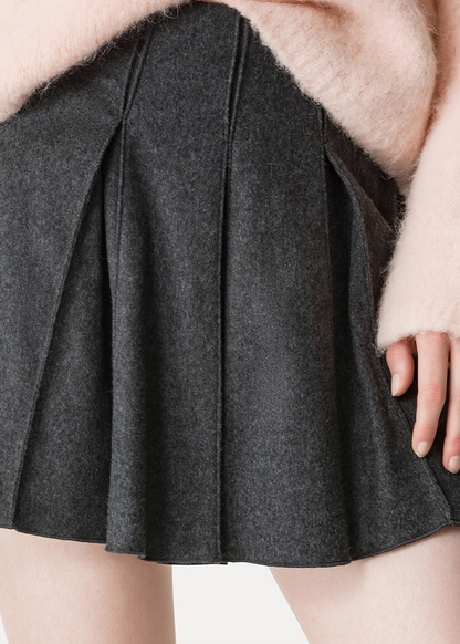 Person wearing Forte forte womens Pleated Wool Mini Skirt grey antracite
