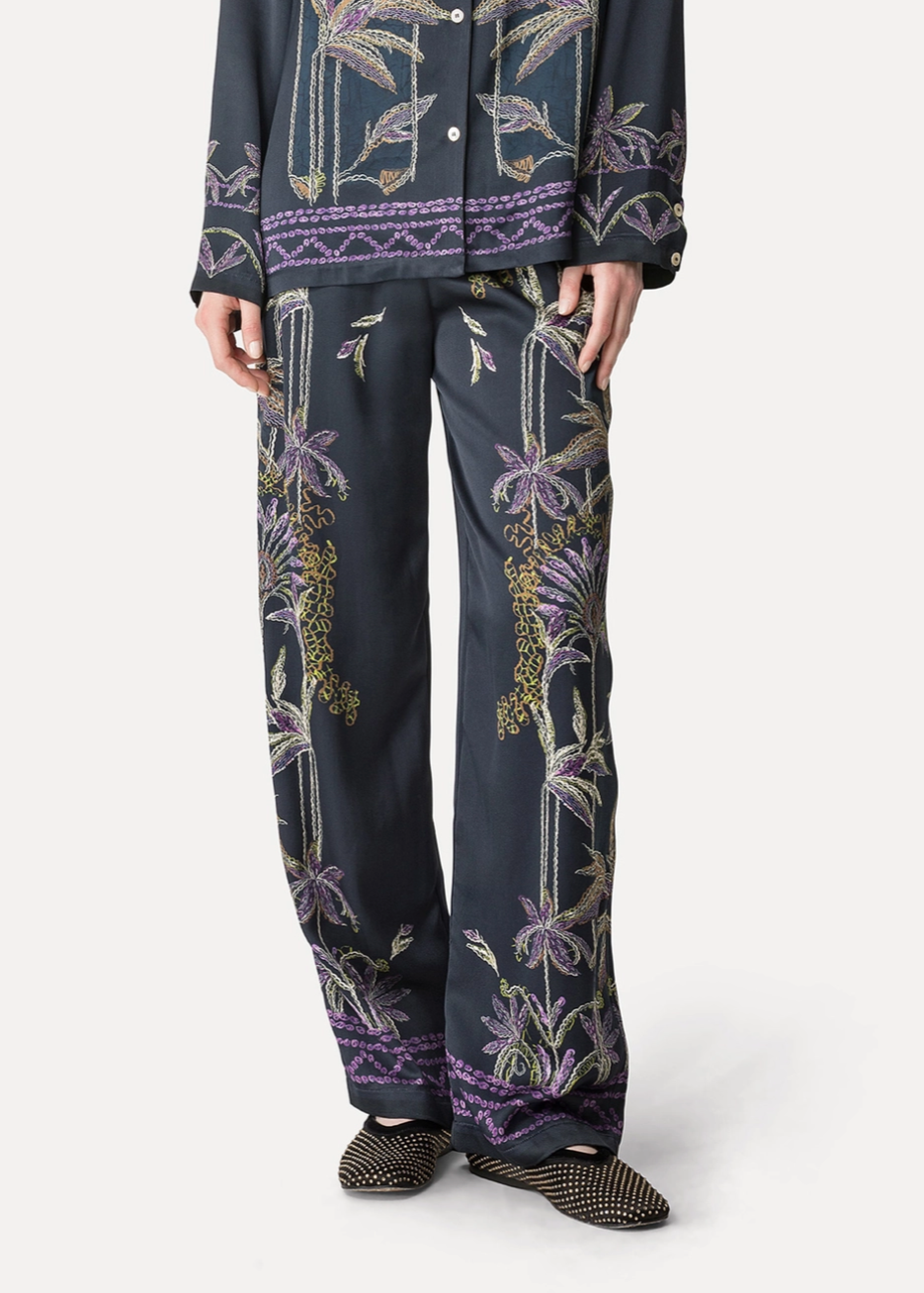 Person wearing Forte forte womens viscose Sogni Print Wide Leg Satin Trousers