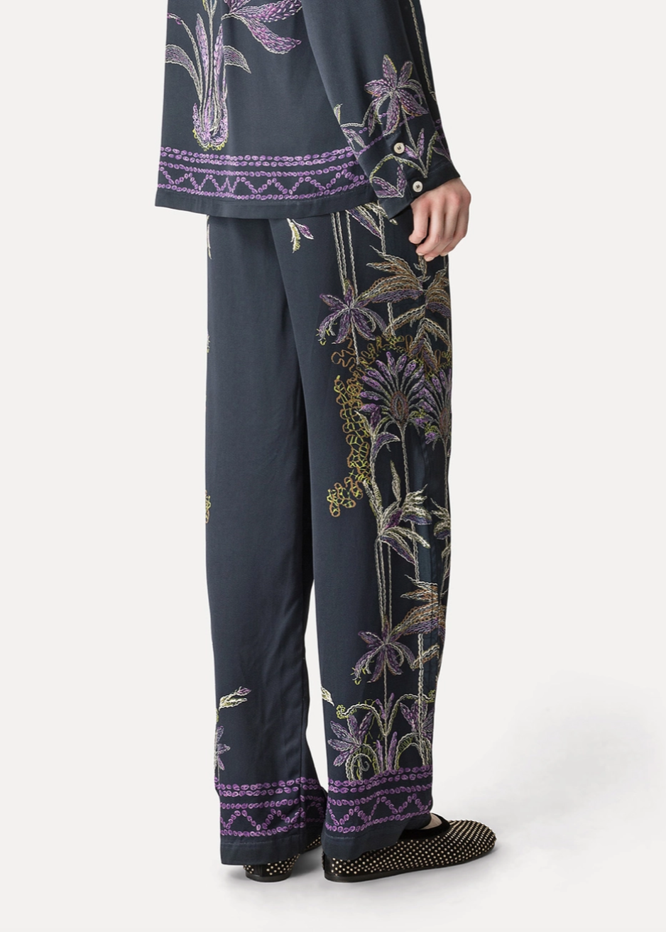 Person wearing Forte forte womens viscose Sogni Print Wide Leg Satin Trousers