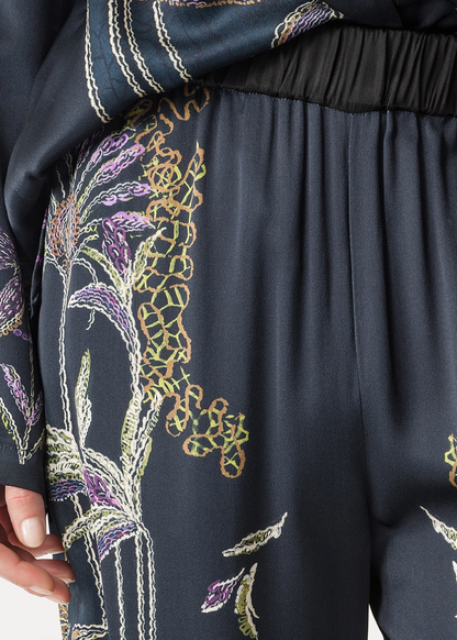 Person wearing Forte forte womens viscose Sogni Print Wide Leg Satin Trousers