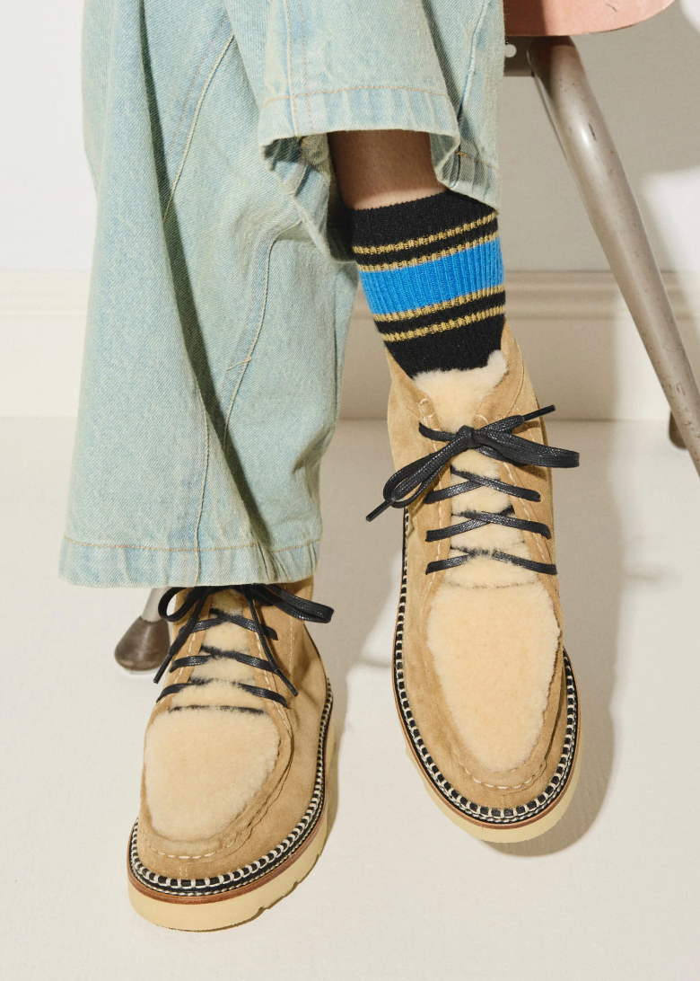 Person wearing Freda Salvador womens Winnie Moccasin Boot in Hazel Suede with Shearling