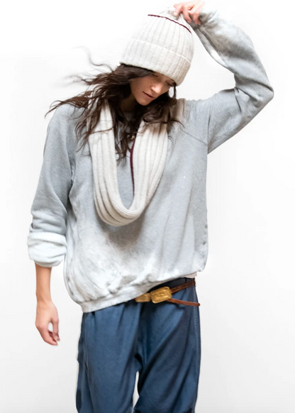 Person wearing Freecity unisex Artists Wanted Bleachout Raglan Sweatshirt