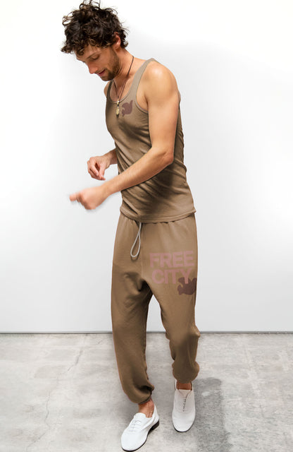 Person wearing Freecity unisex Flow Sweatpant in Moonshrooms Bronzer
