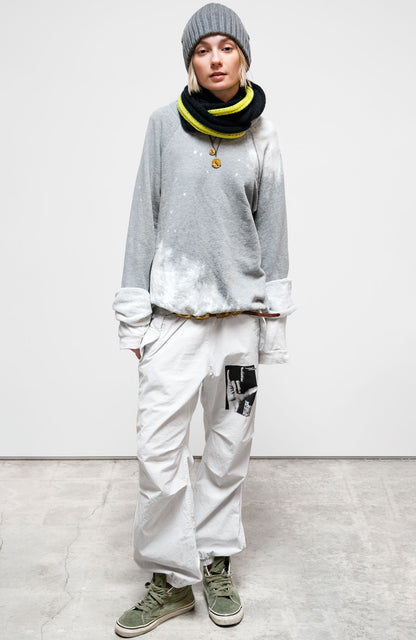 Person wearing Freecity unisex Lucky Rabbits Sweatshirt in Bleachout Heather