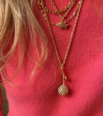Person wearing Grace Winfrey fine jewelry 18k yellow gold diamond Dandelion Pendant Necklace
