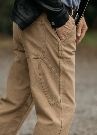 Person wearing Hiroshi Kato mens The Double Knee Pants Classic Straight in Sawdust