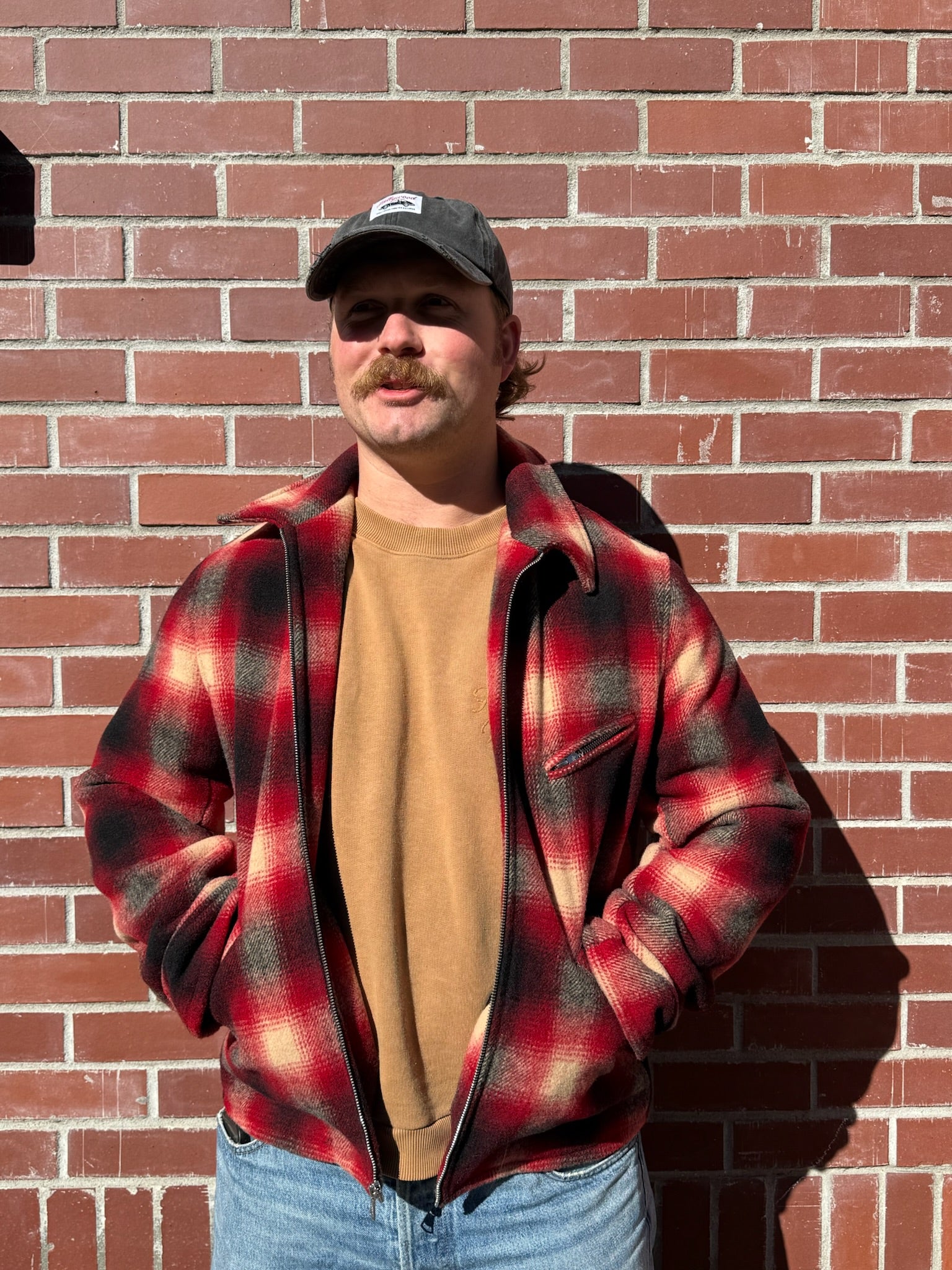 Person wearing Hollywood Forever Records mens wool Plaid Hunter Jacket