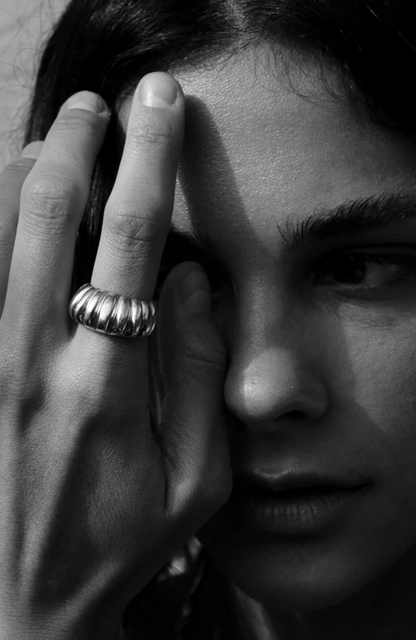 Person wearing Howl fine jewelry 18k yellow gold Bombshell Ring with Rubies