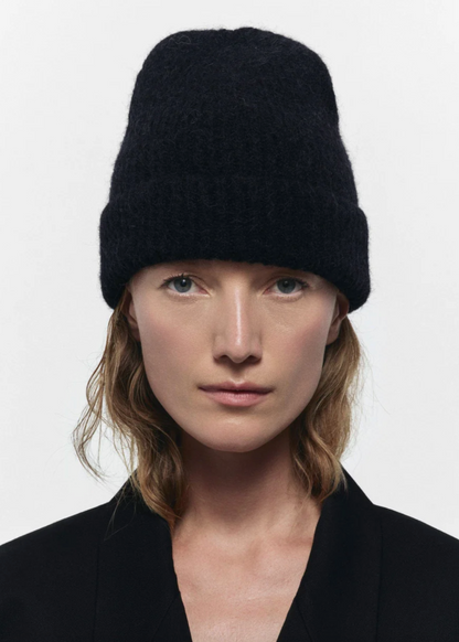 Person wearing Janessa Leone The Piper Beanie in Black Wool