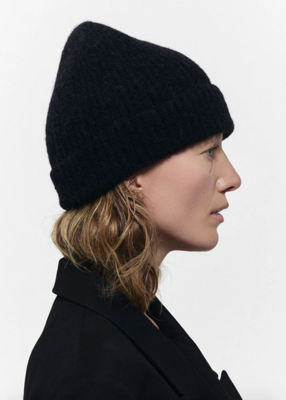 Person wearing Janessa Leone The Piper Beanie in Black Wool