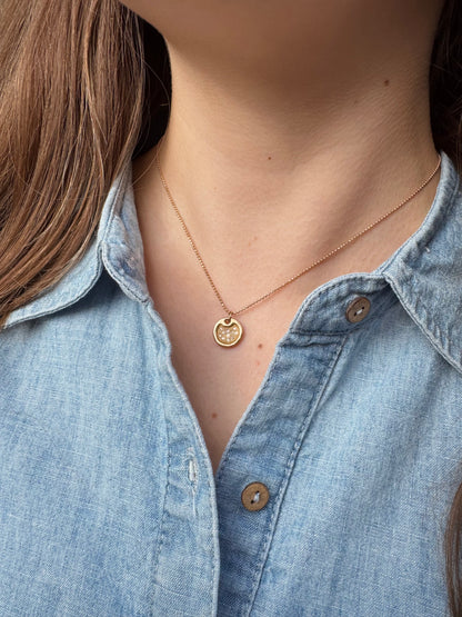Person wearing Julez Bryant fine jewelry 14k rose gold 1mm Diamond Cut Ball Chain with Dena 14k Baby Round Dog Tag with Diamonds