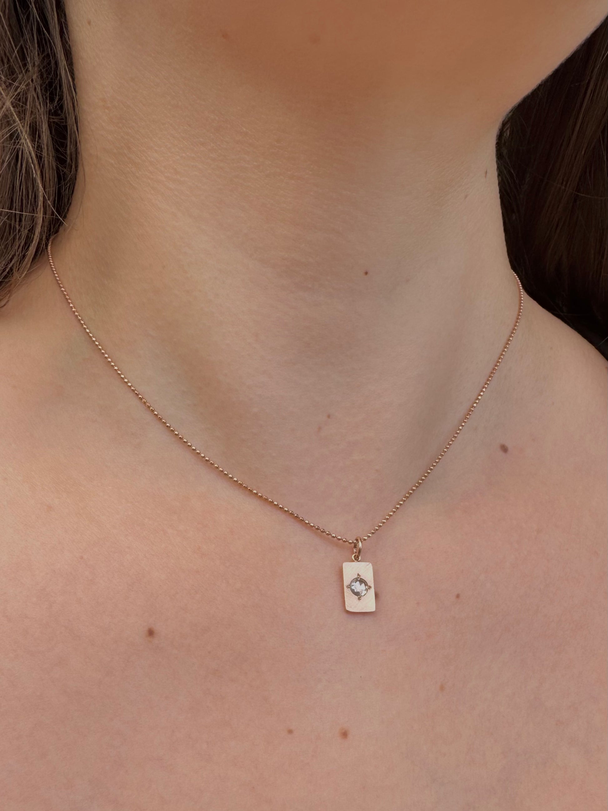 Person wearing Julez Bryant fine jewelry 14k rose gold Baby Rose Cut Diamond Pendant