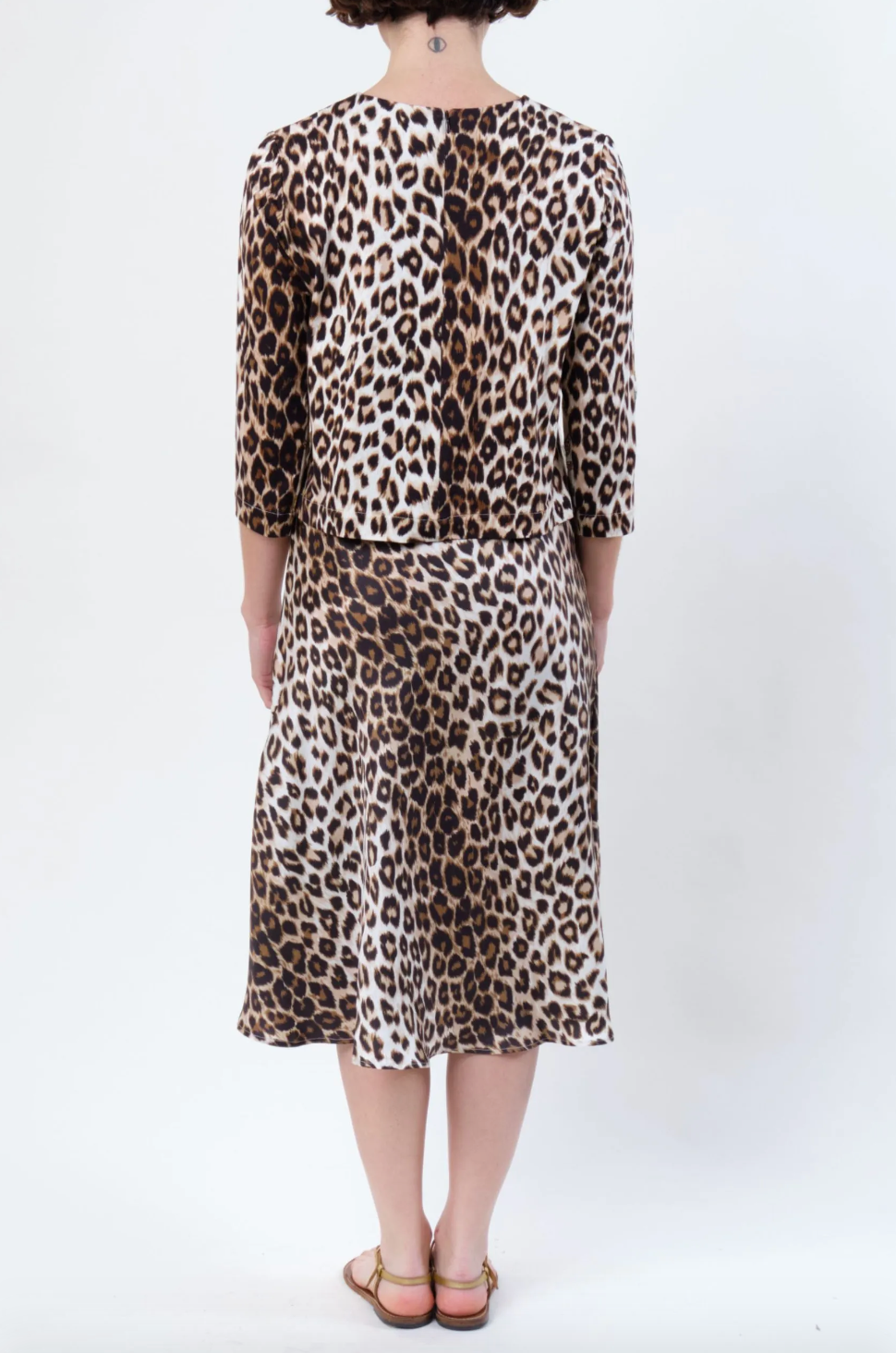 Person wearing La Prestic Ouiston womens Silk Twill Nola Panther Midi Skirt