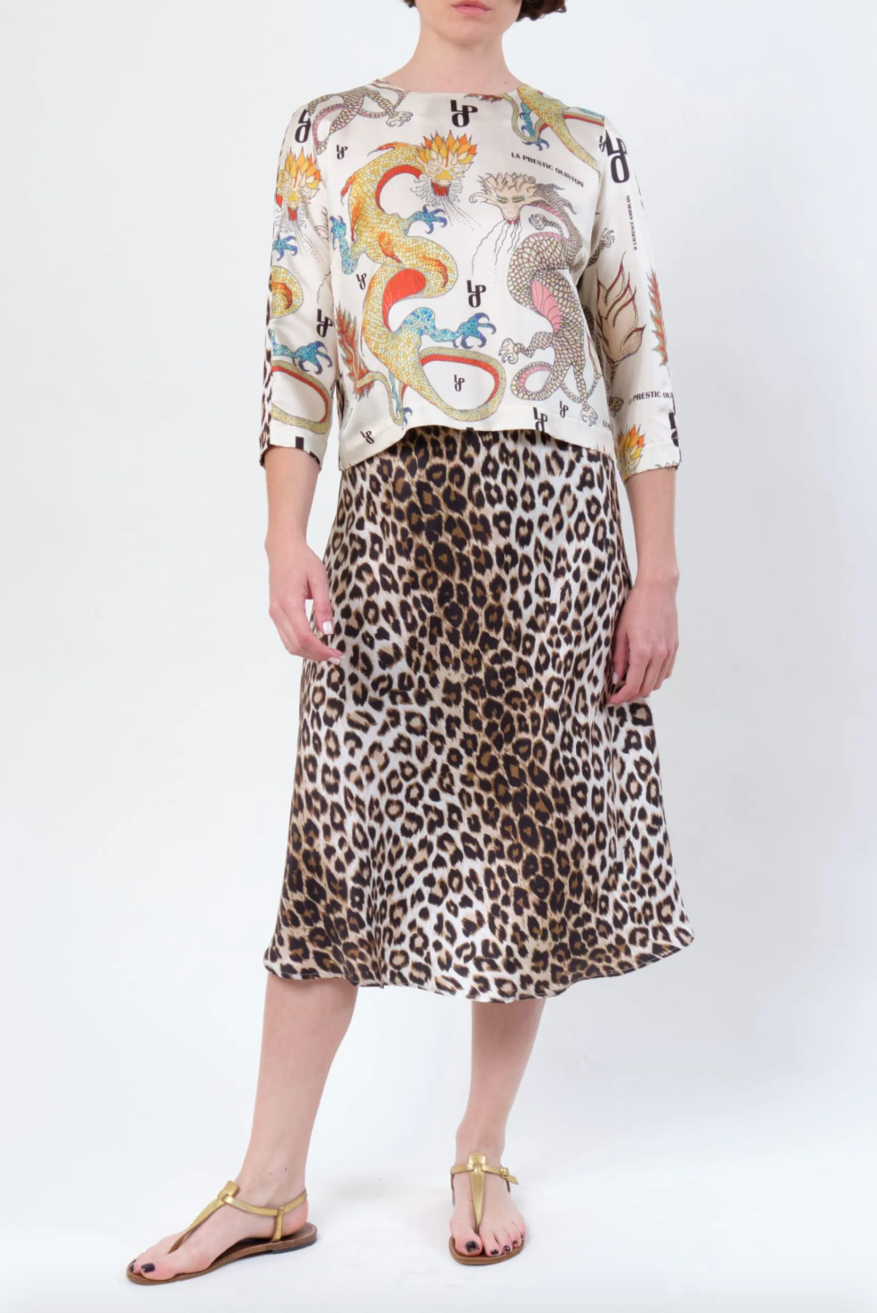 Person wearing La Prestic Ouiston womens Silk Twill Nola Panther Midi Skirt