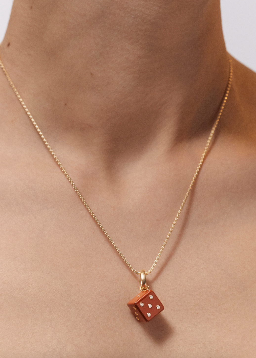 Person wearing Marie Lichtenberg fine jewelry 18k yellow gold Jasper Dado Pendant Necklace