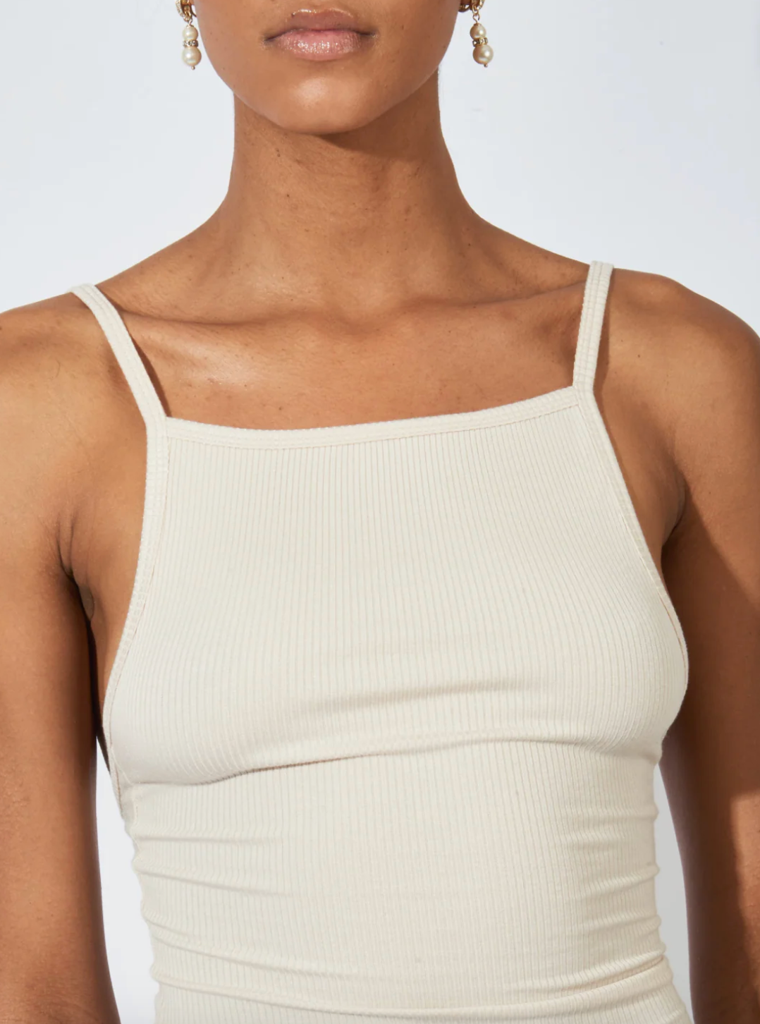 Person wearing Nia Thomas Othella Tank in Sand