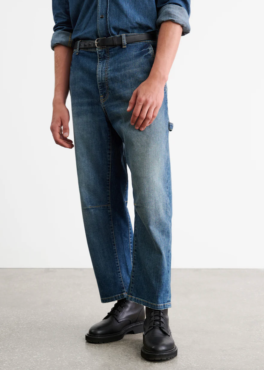 Person wearing Nili Lotan Men's Carpenter Jean in Classic Wash