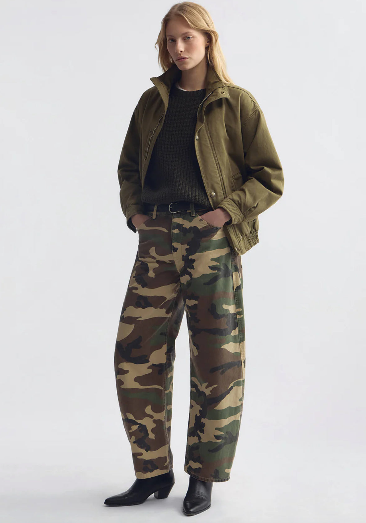 Person wearing Nili Lotan womens Tribeca Cotton Pant in khaki overdyed camo