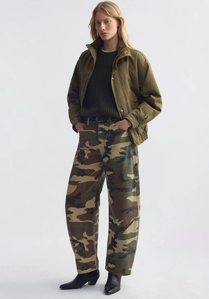 Person wearing Nili Lotan womens Tribeca Cotton Pant in khaki overdyed camo