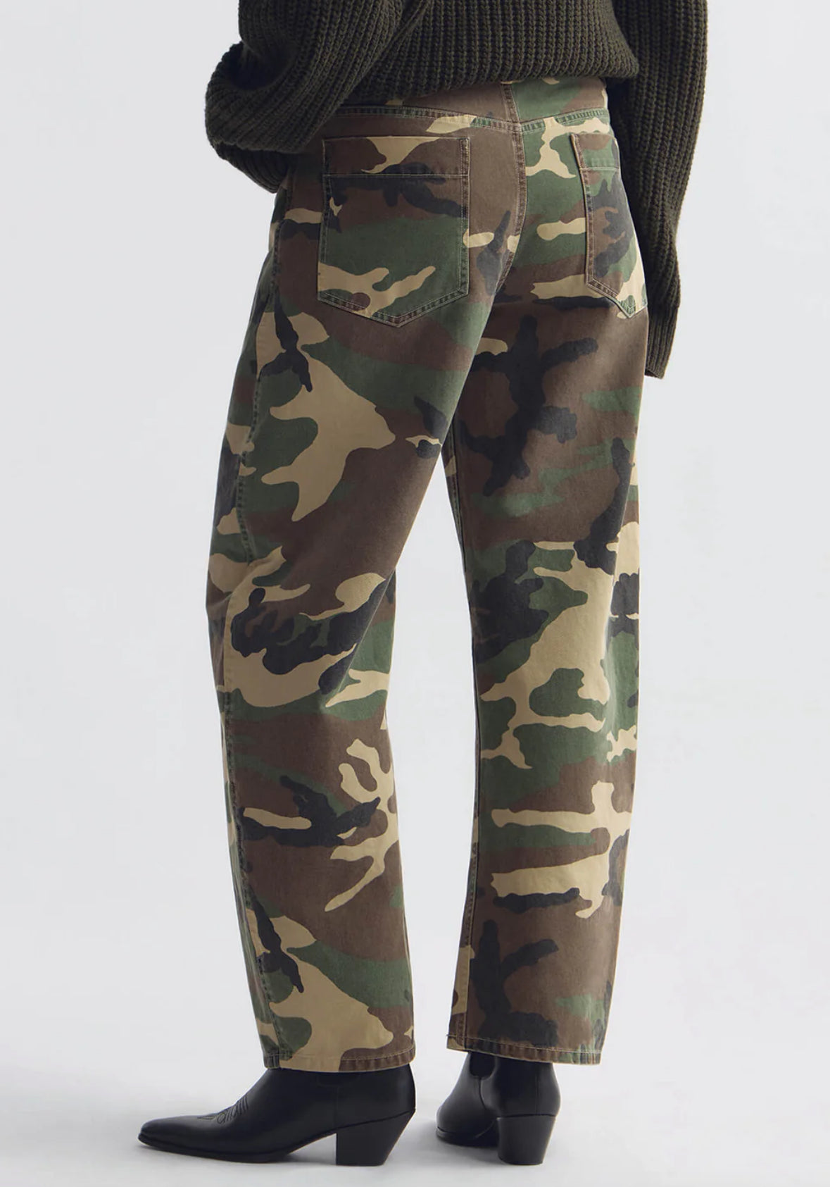 Person wearing Nili Lotan womens Tribeca Cotton Pant in khaki overdyed camo
