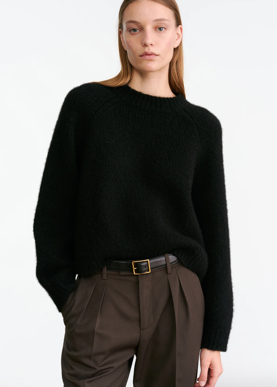 Person wearing Nili Lotan womens cashmere Tomaso Sweater in Black