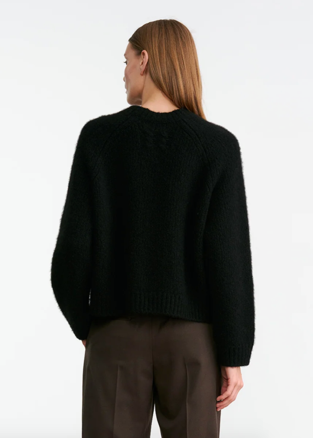 Person wearing Nili Lotan womens cashmere Tomaso Sweater in Black