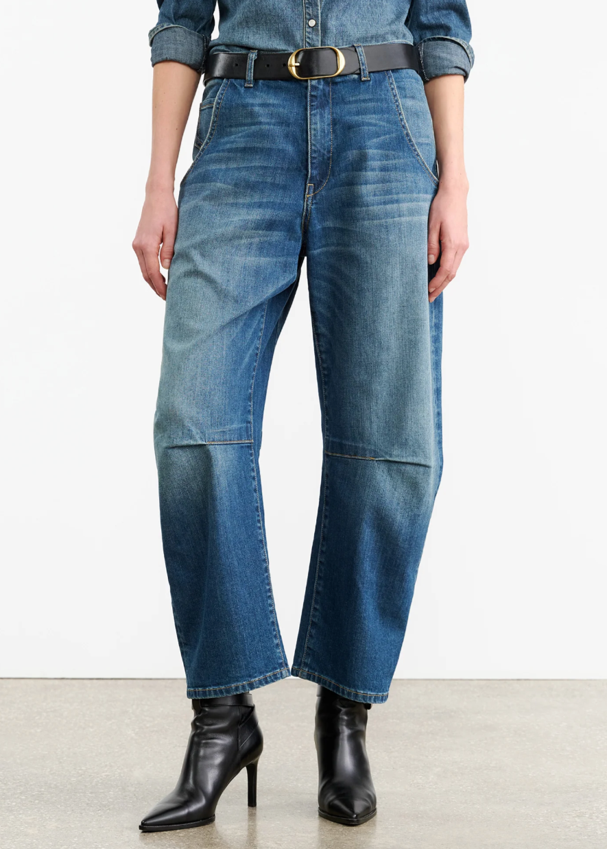 Person wearing Nili Lotan womens denim Emerson Jean in Classic Wash