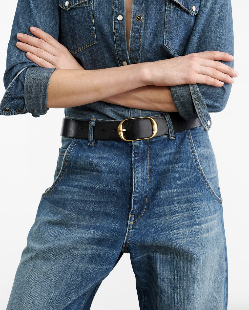 Person wearing Nili Lotan womens denim Emerson Jean in Classic Wash