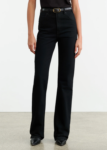 Person wearing Nili Lotan womens denim Joan Jean in Distressed Black