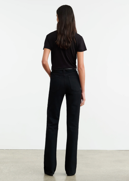 Person wearing Nili Lotan womens denim Joan Jean in Distressed Black